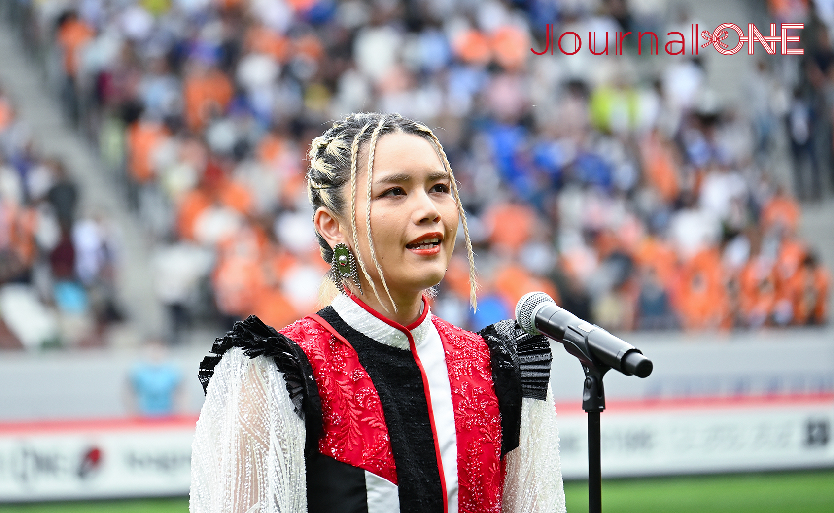 Singer-songwriter Anly sang the national anthem.; Photo by Journal-ONE
